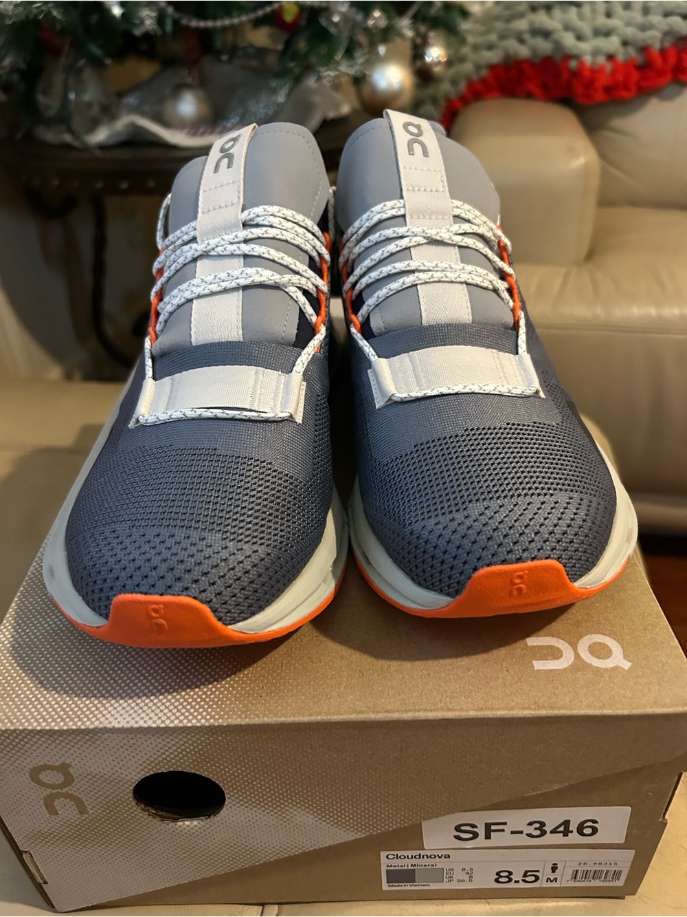 On Cloud Cloudnova men's athletic shoes in gray and orange
